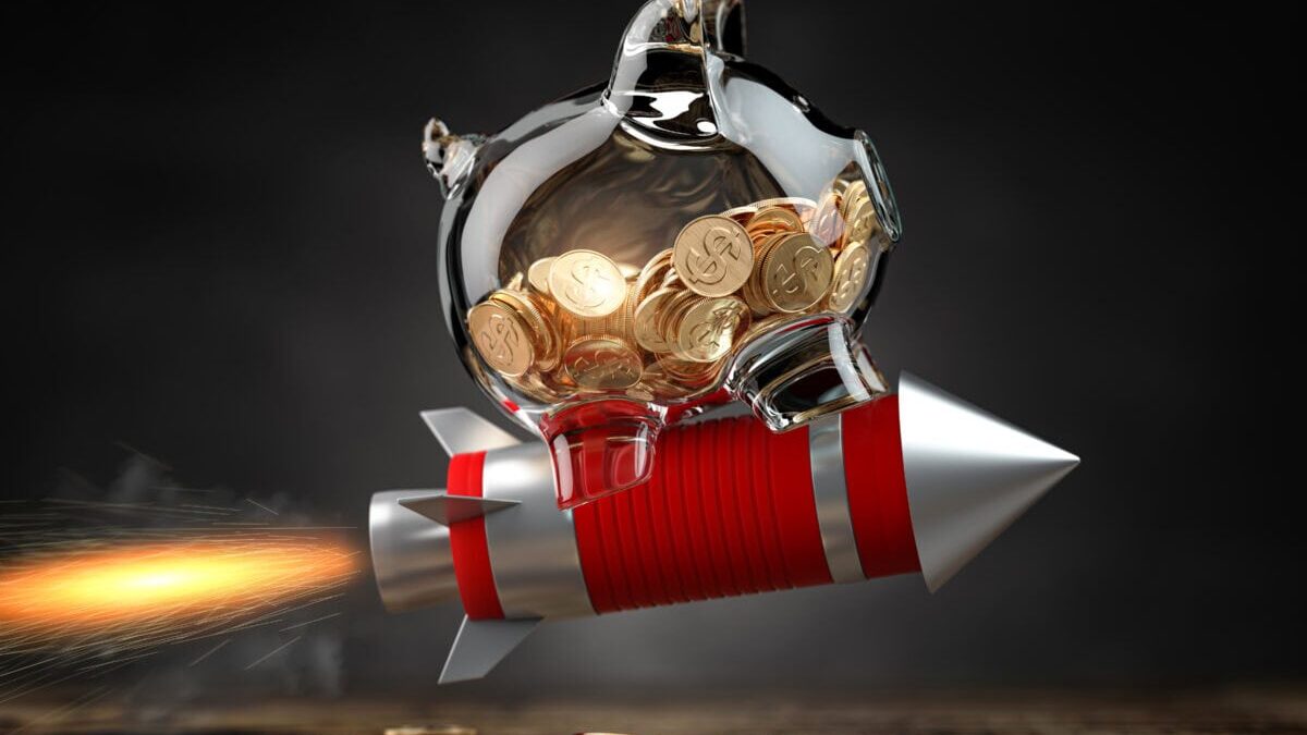 Piggy bank on a flying rocket